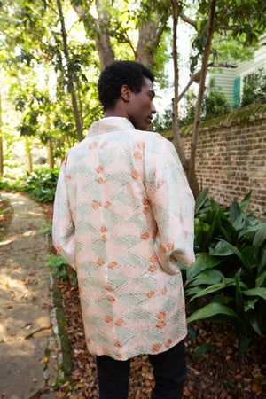 Male model is pink and green upcycled vintage kimono jacket