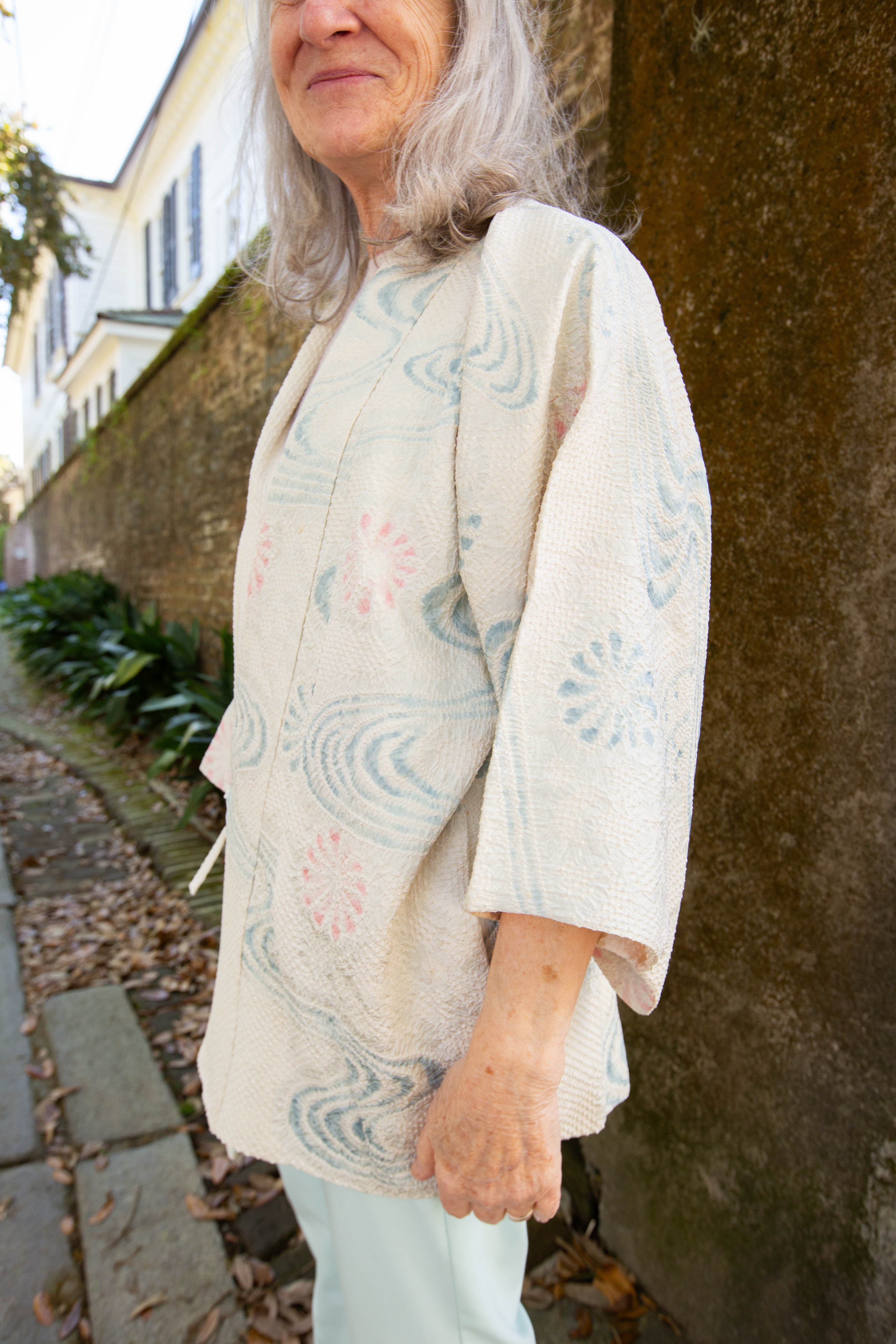 woman in white silk vintage kimono jacket with ties