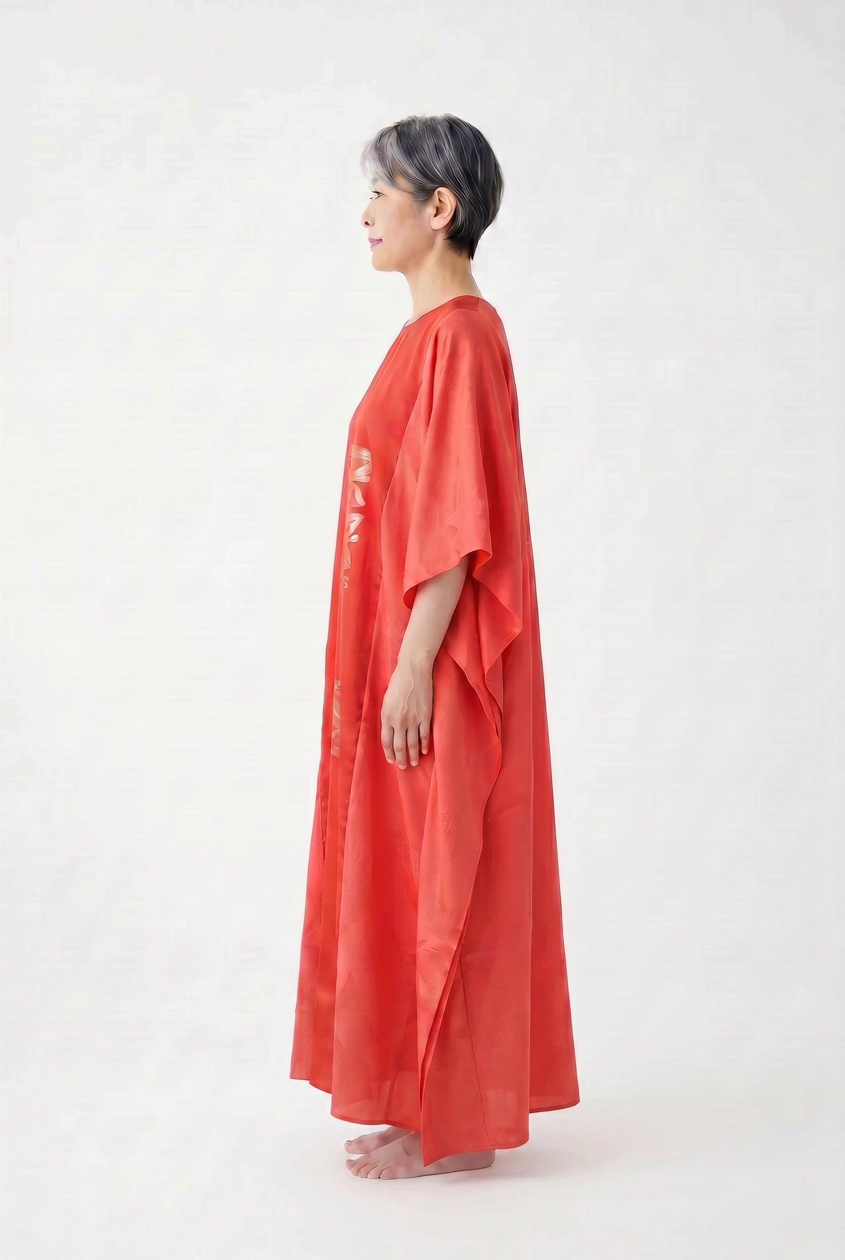Coral silk caftan dress with woven silver design