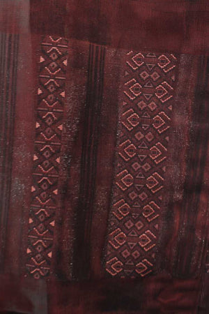 detail of woven design in a brown summer silk of a kimono jacket