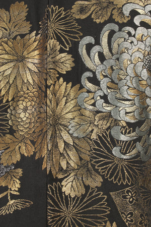 detail of metallic threads woven into chrysanthemums in silk kimono jacket