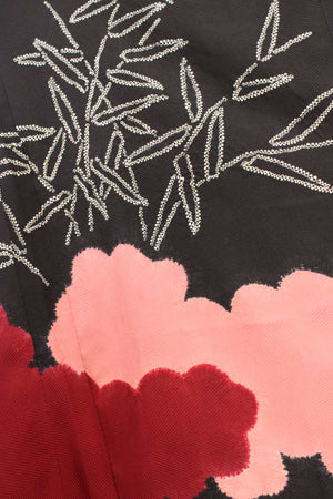 detail of shibori design for vintage kimono jacket  of white branches and red and pink clouds