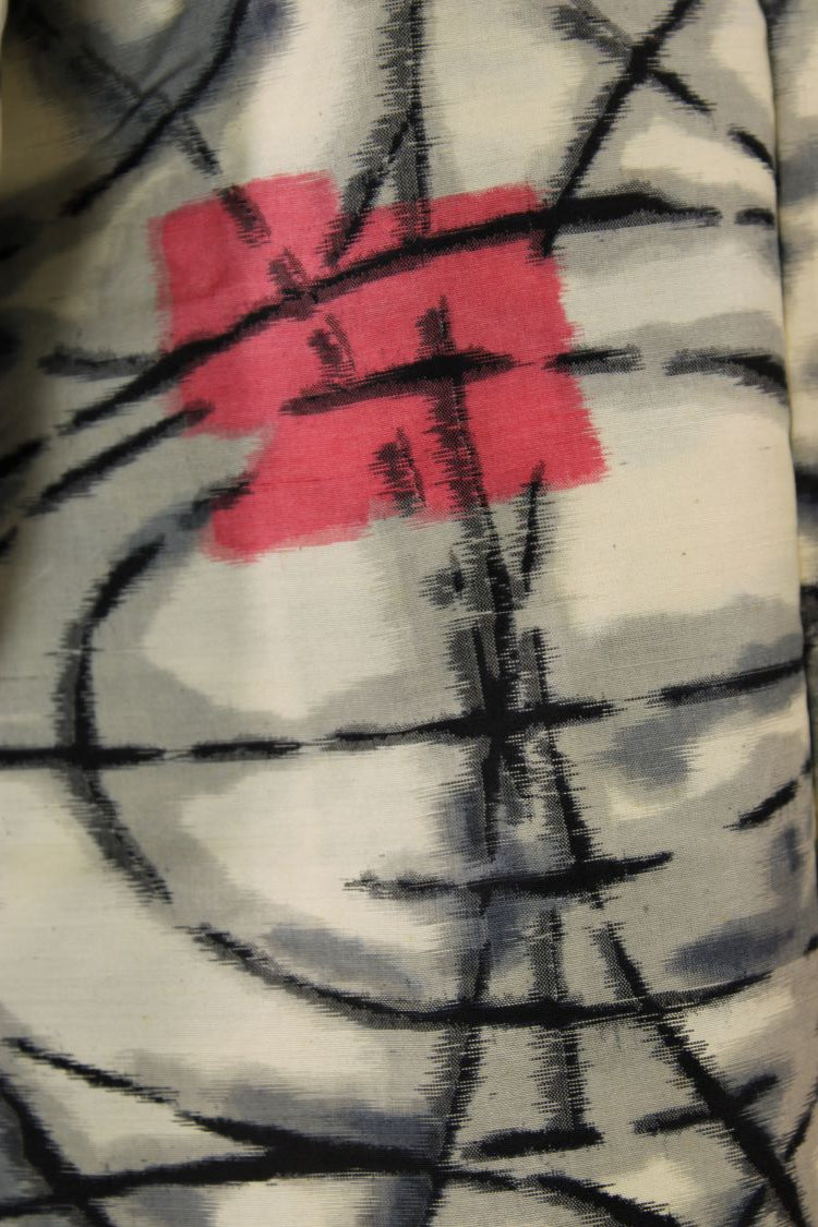 detail of woven design in black white and red on vintage kimono jacket