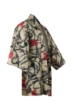 side view of black and white silk kimono jacket showing refashioned sleeves