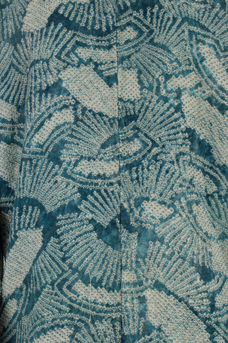 detail of hand knotted design in turquoise silk from vintage kimono coat