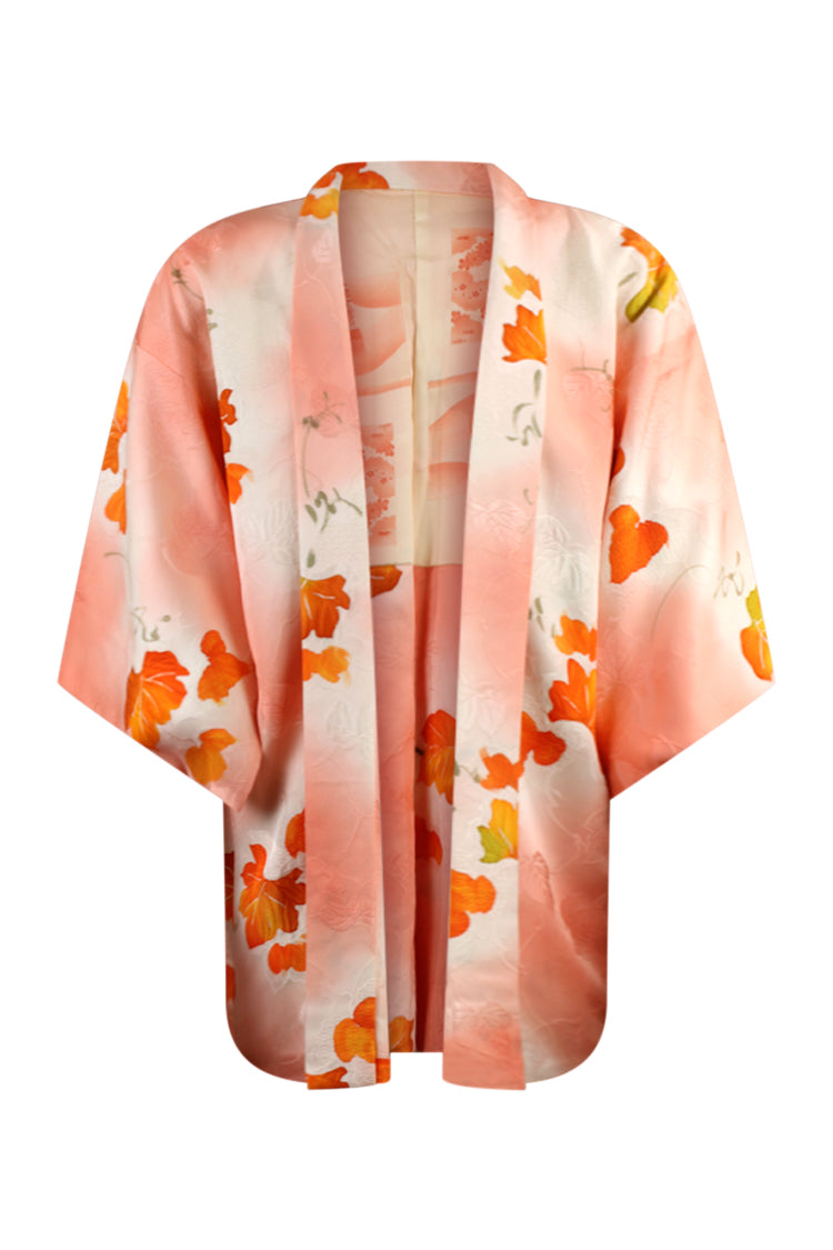 one size fits most silk kimono jacket in orange and white on a large model