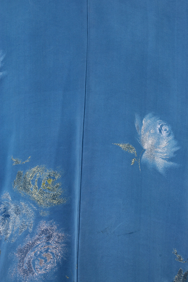 detail of woven silver design in blue silk from vintage kimono jackeet