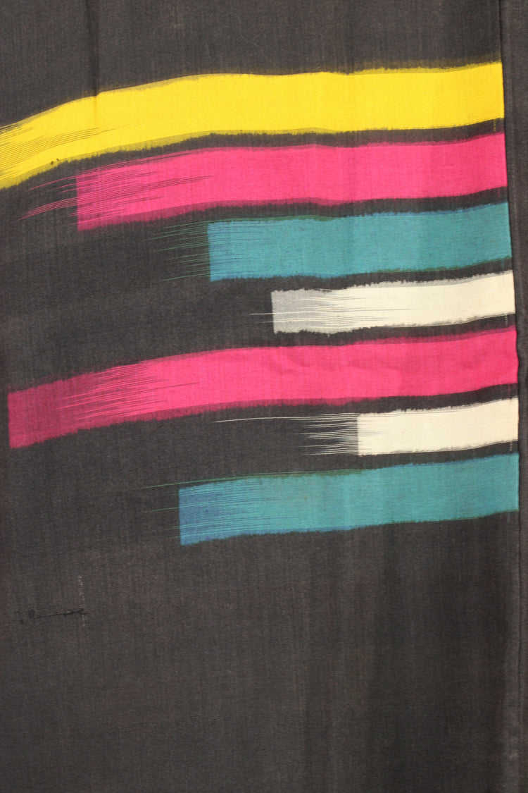 detail of ikat weave in black silk jacket