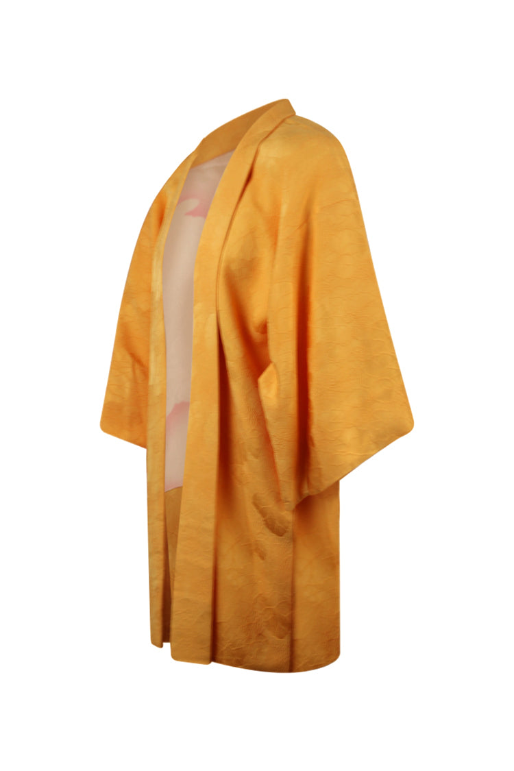 side view of yellow kimono jacket with white and pink lining