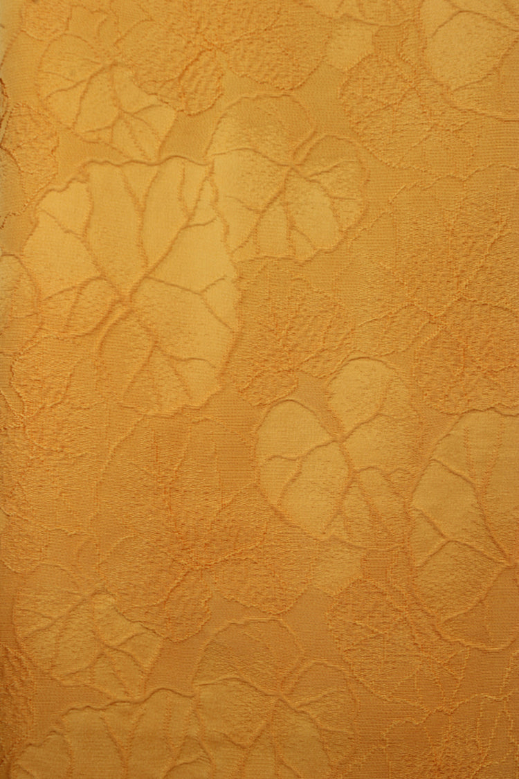 detail of raised leaves on yellow silk from vintage kimono jacket