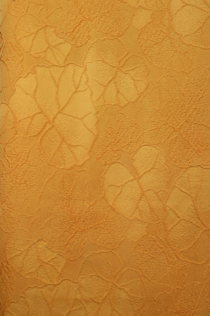 detail of raised leaves on yellow silk from vintage kimono jacket