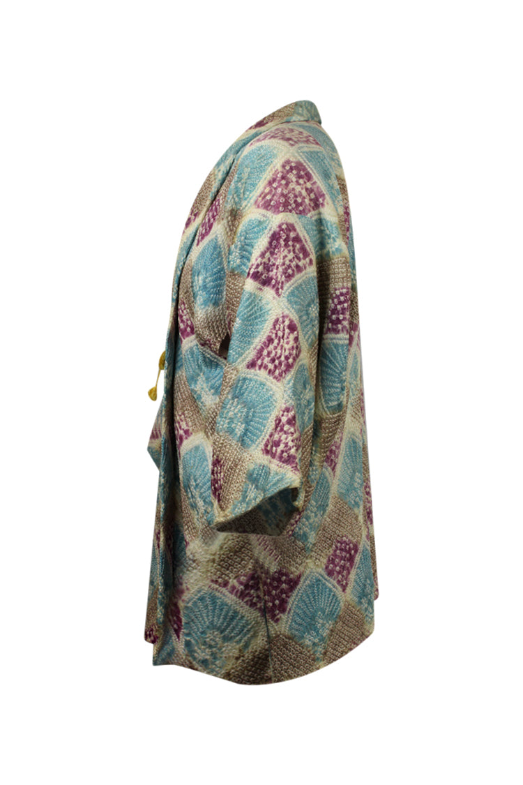 side view of silk refashioned kimono jacket in blue purple and beige shibori design