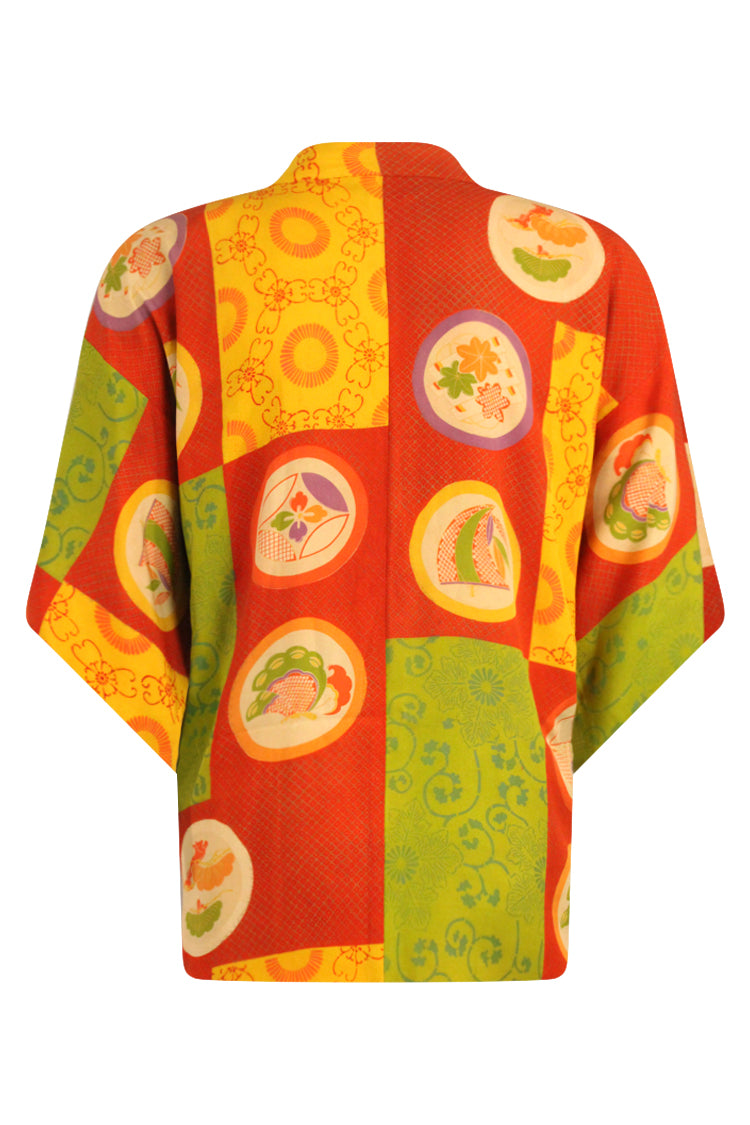 back view on large model of orange green and yellow vintage silk kimono jacket