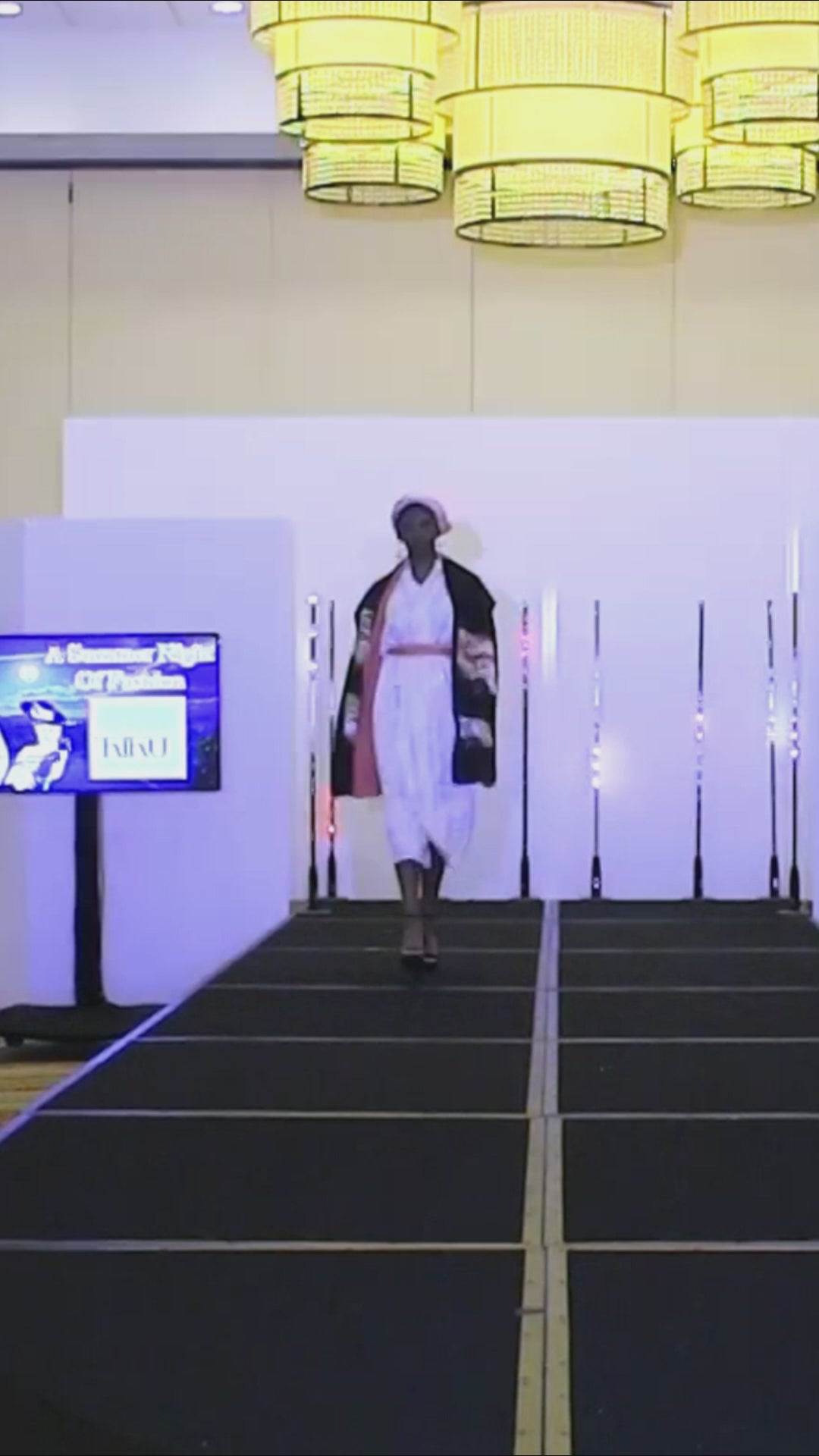 runway model in white kimono and black shawl