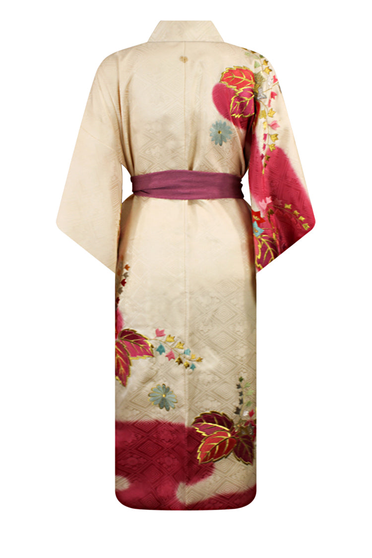 cream and rose colored silk kimono with designs around hem 