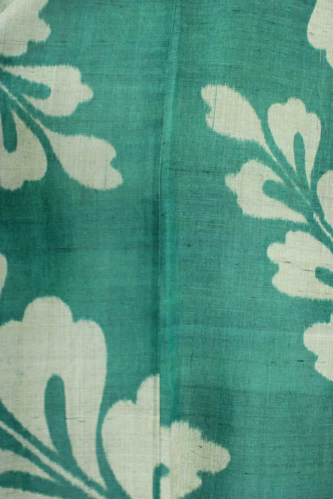 detail of emerald green summer silk with ikate weave