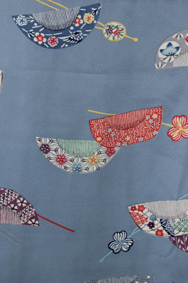 detail of hand painted combs on baby blue silk from vintage kimono