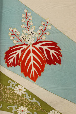 detail of hand painted flowers with gold leaf outlines on vintage kimono