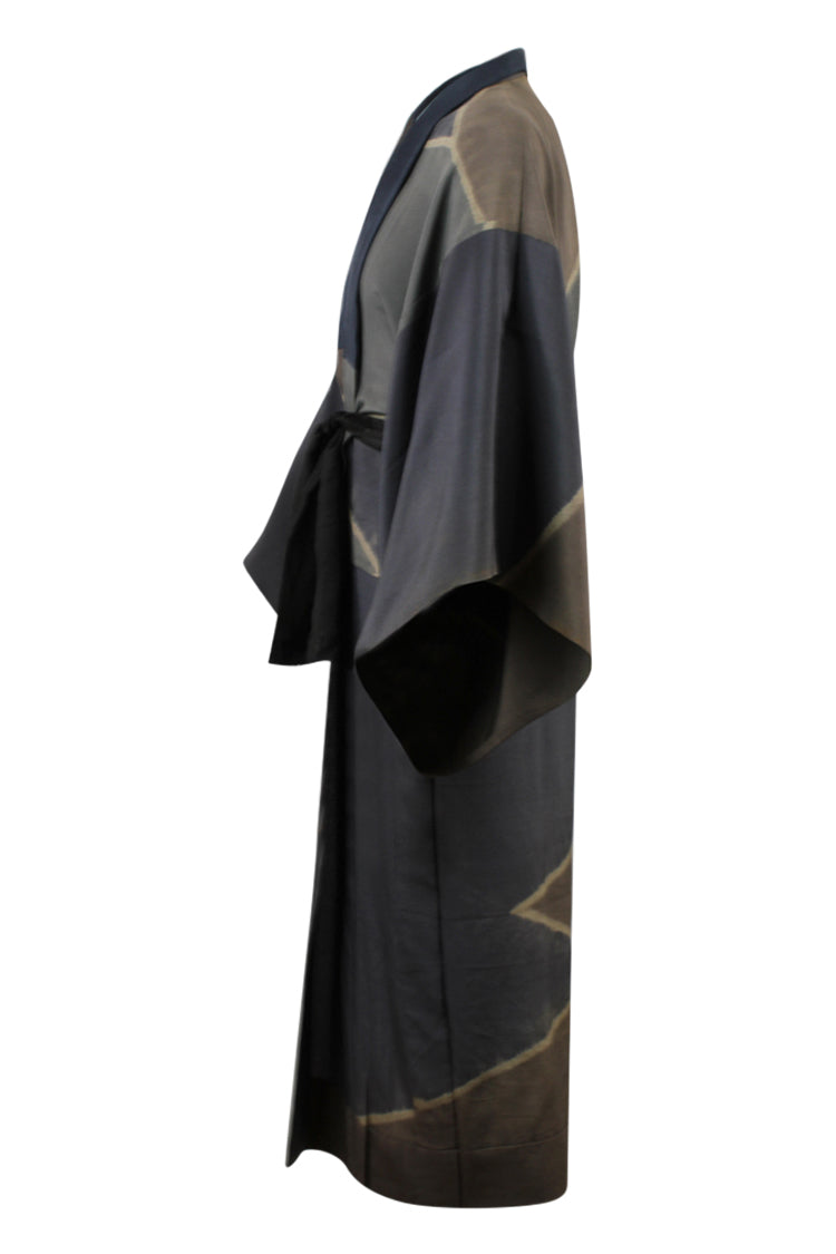 side view of man's kimono with wide sleeves in browns and grays