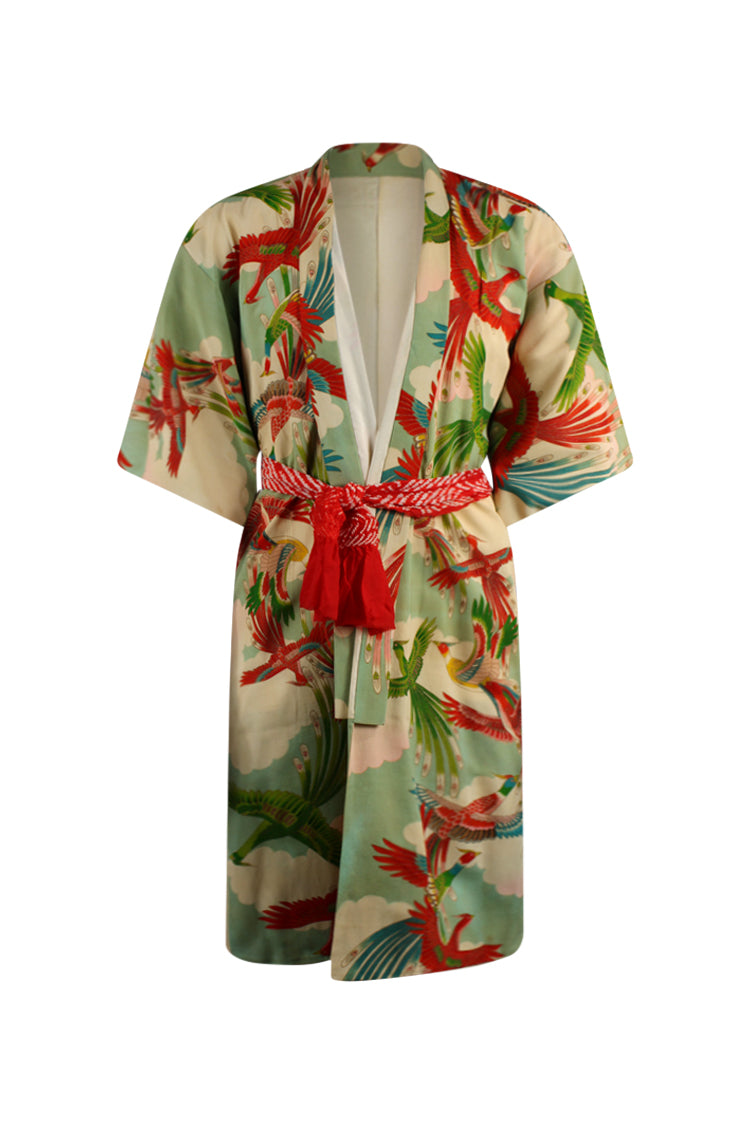 front view on large model of young woman's vintage kimono with red and green birds