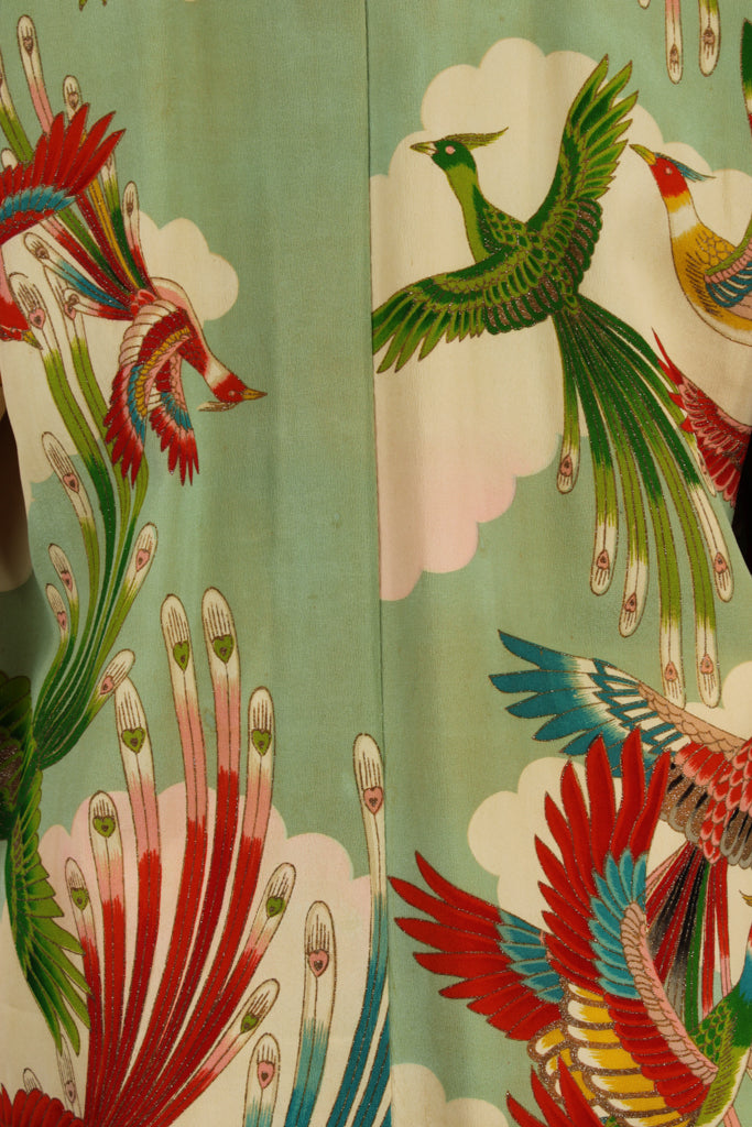 Detail of red and green phoenix birds on vintage kimono