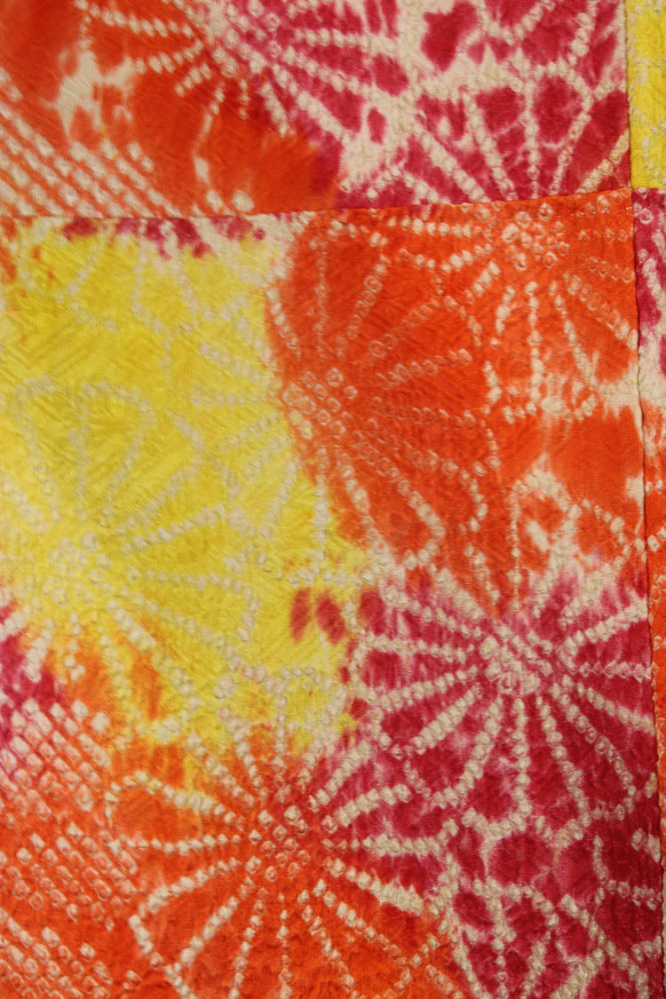 detail of vintage silk for kimono robe orange and yellow flowers