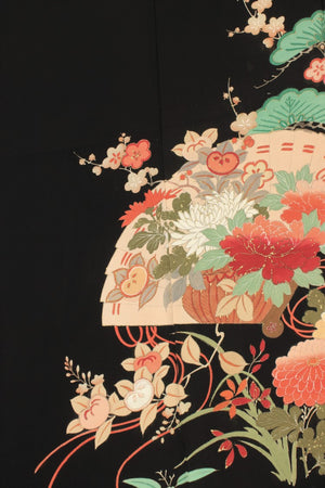 detail of hand painted yuzen on black silk