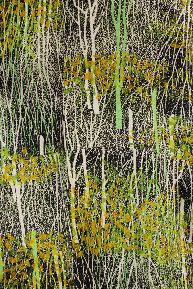 detail of kimono silk with white and green trees and gold leaves