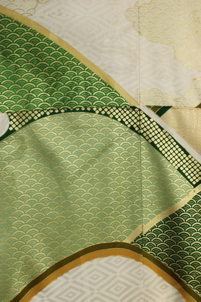 detail of gold stenciling on greens of vintage kimono silk