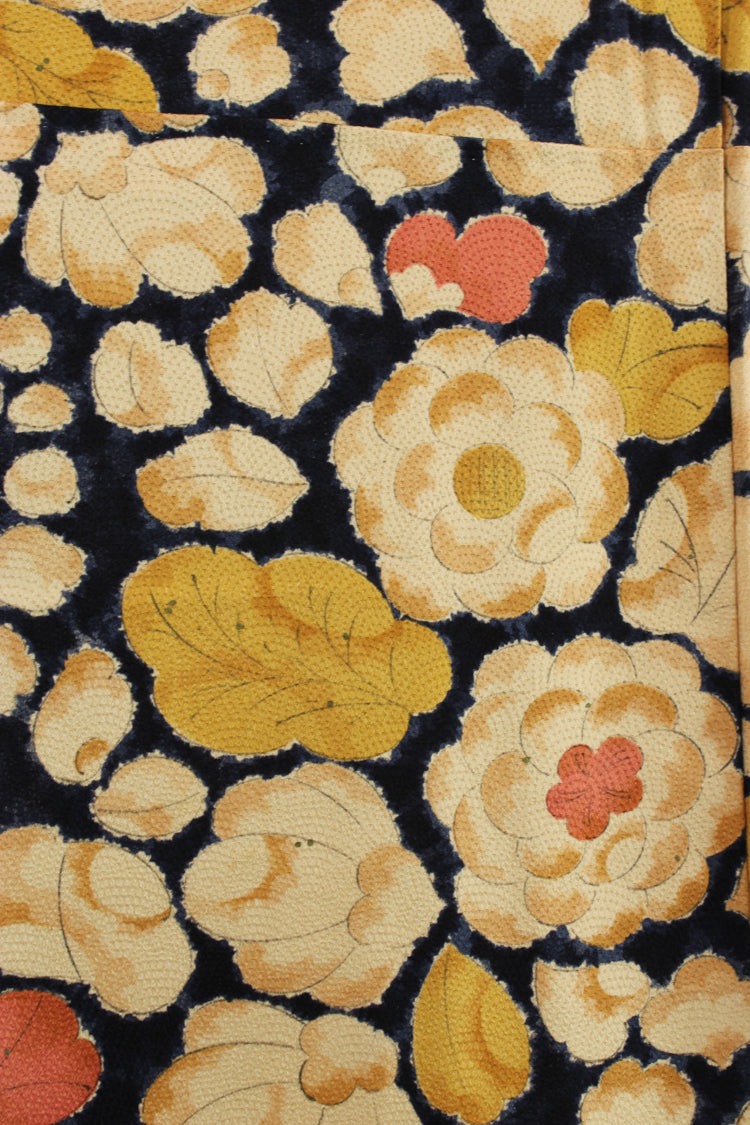 detail of vintage silk with raised woven design and flowers