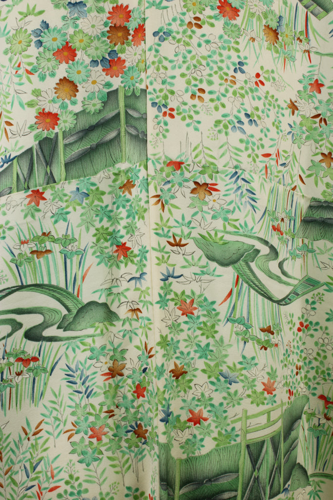 detail of the green, white and orange floral print from vintage kimono