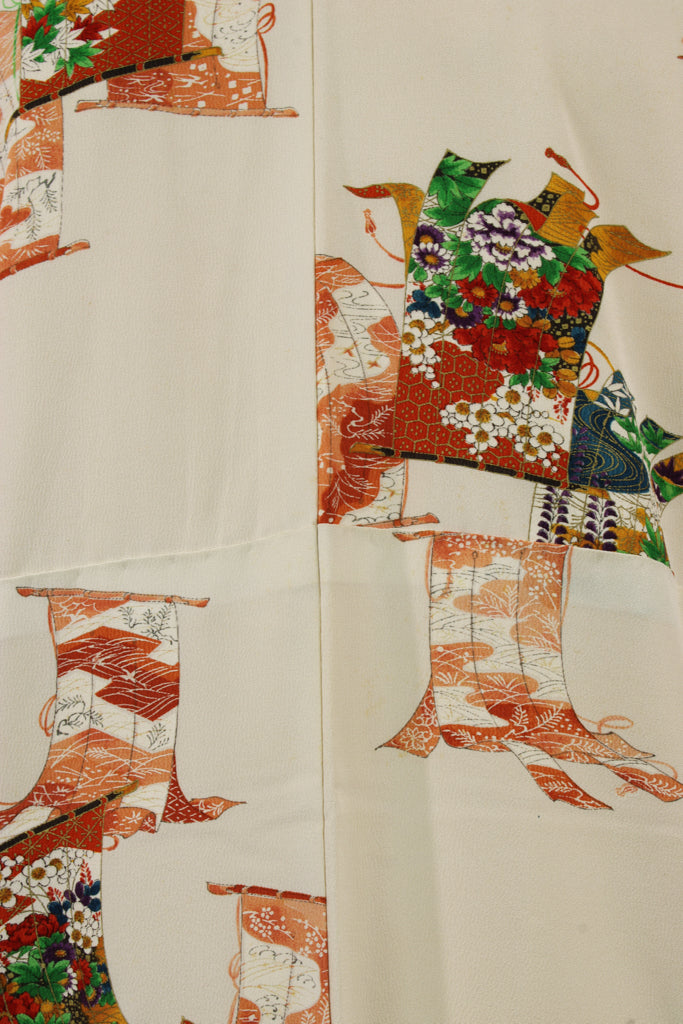detail of vintage kimono silk decorated with colorful ancient banners