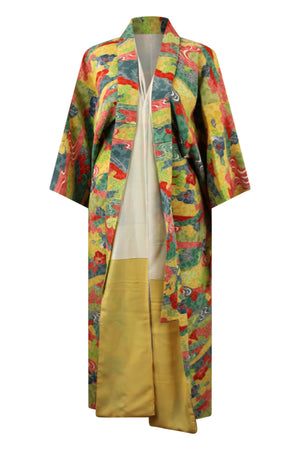 front view on a small model of a colorful upcycled kimono with reduced sleeves and hem