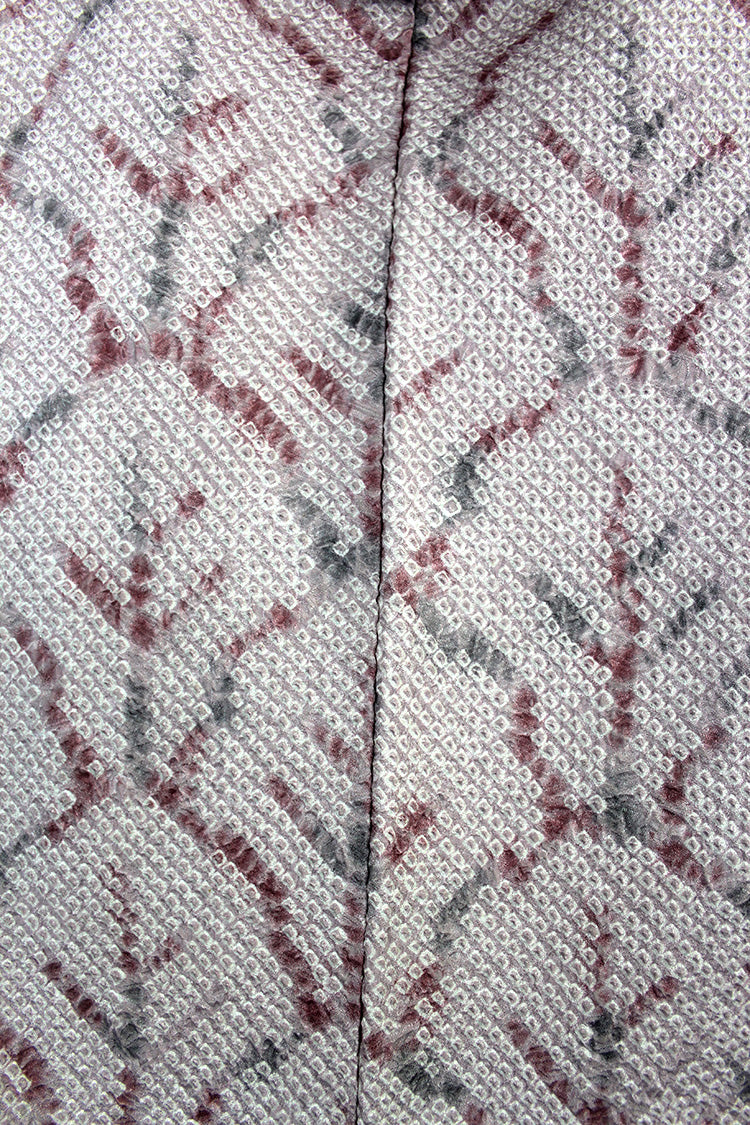 Closeup of the abstract trees tie dye design print over the seam.