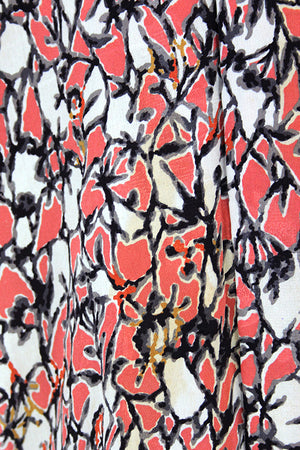 Textile pattern photo of the peach, cream and black abstract pattern. 