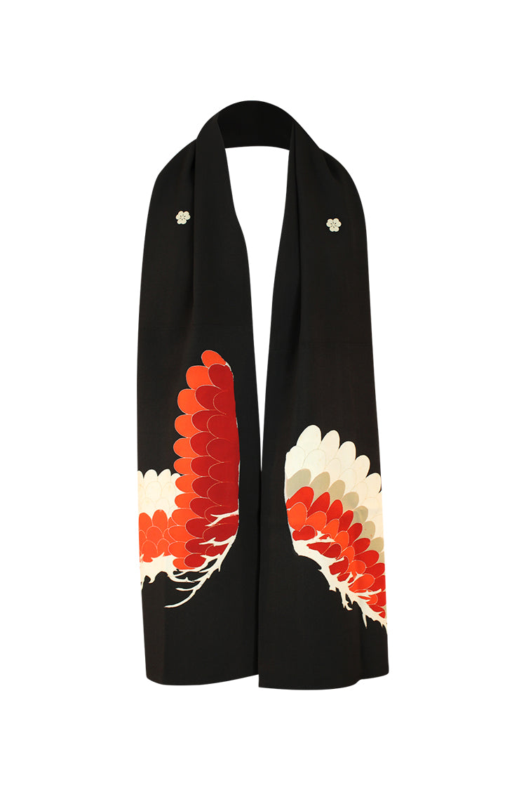 reverse side of refashioned scarf with two family crests and orange feather design