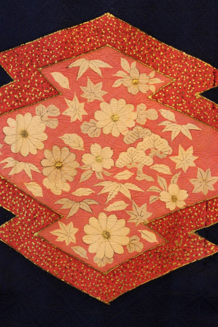 detail of pink diamonds with gold and hand painted flowers