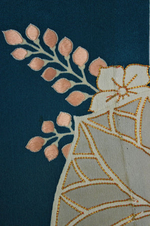 detail showing embroidery and gold trime on kimono silk scarf