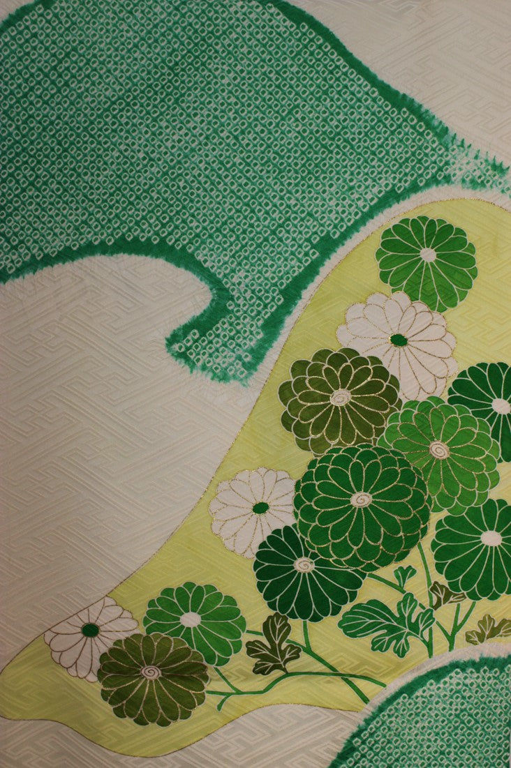 silk detail with green shibori and gold outlined flowers on cream base