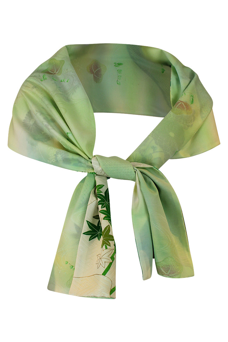 tied scarf reversible with mottled green lining showing 