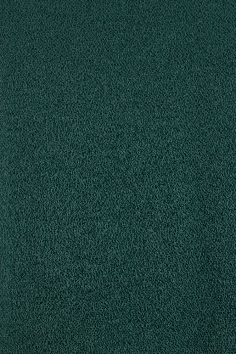 detail of dark green crepe silk